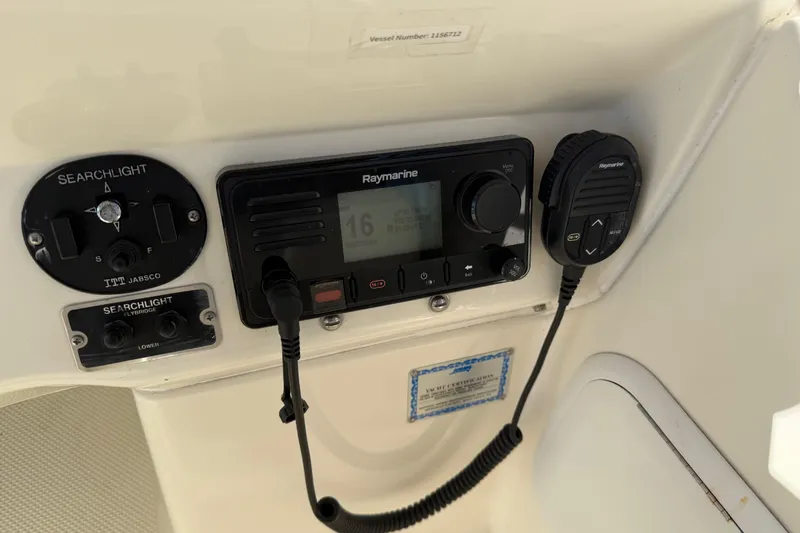  Yacht Photos Pics Control panel of a 2004 Meridian 411 Sedan with Raymarine radio and searchlight controls.