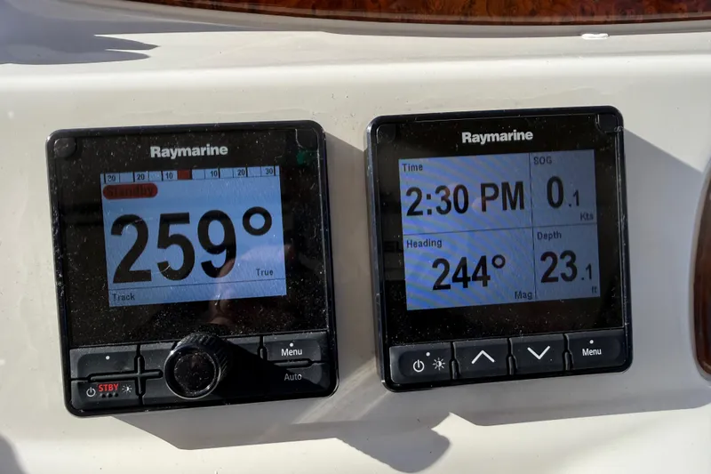  Yacht Photos Pics Raymarine navigation displays on a 2004 Meridian 411 Sedan, showing heading and depth.