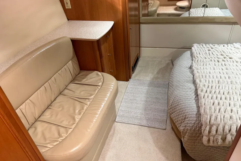 Yacht Photos Pics Interior of 2004 Meridian 411 Sedan with beige seating and cozy bed.