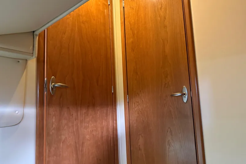  Yacht Photos Pics Wooden interior doors with metal handles on a 2004 Meridian 411 Sedan yacht.