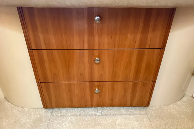  Yacht Photos Pics Wooden drawers in a 2004 Meridian 411 Sedan interior, featuring sleek metal handles.