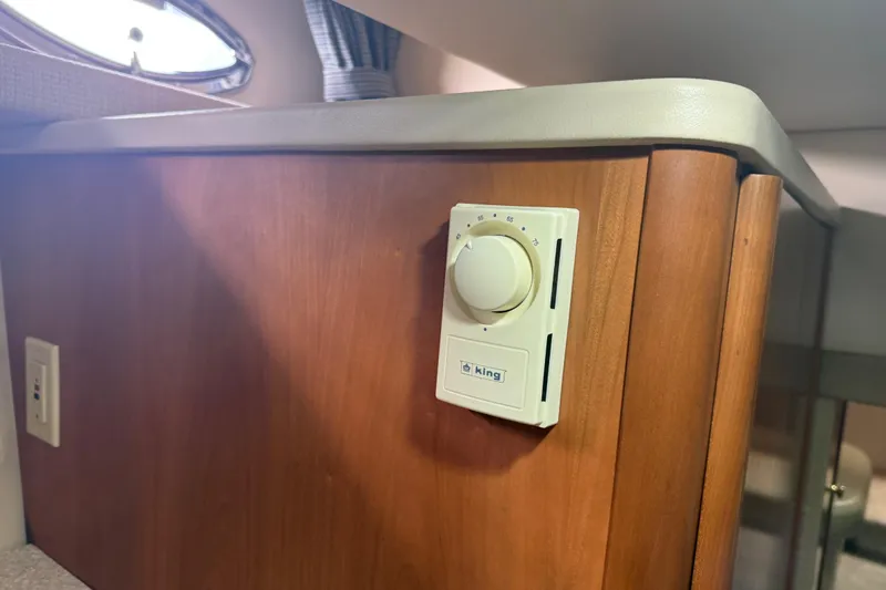  Yacht Photos Pics Thermostat on wooden panel inside 2004 Meridian 411 Sedan boat interior.