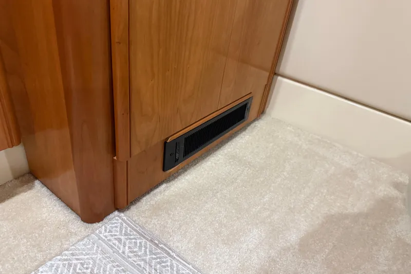  Yacht Photos Pics Wooden cabinet with vent on carpeted floor, Meridian 411 Sedan 2004 interior.