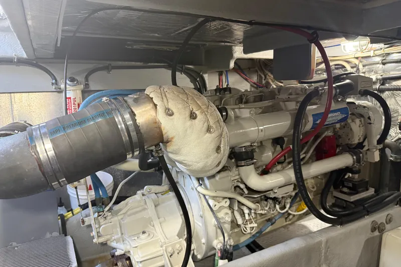  Yacht Photos Pics Engine room of a 2004 Meridian 411 Sedan with visible marine engine components.