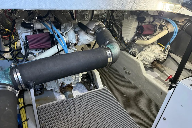  Yacht Photos Pics Engine room of a 2004 Meridian 411 Sedan with visible components and hoses.