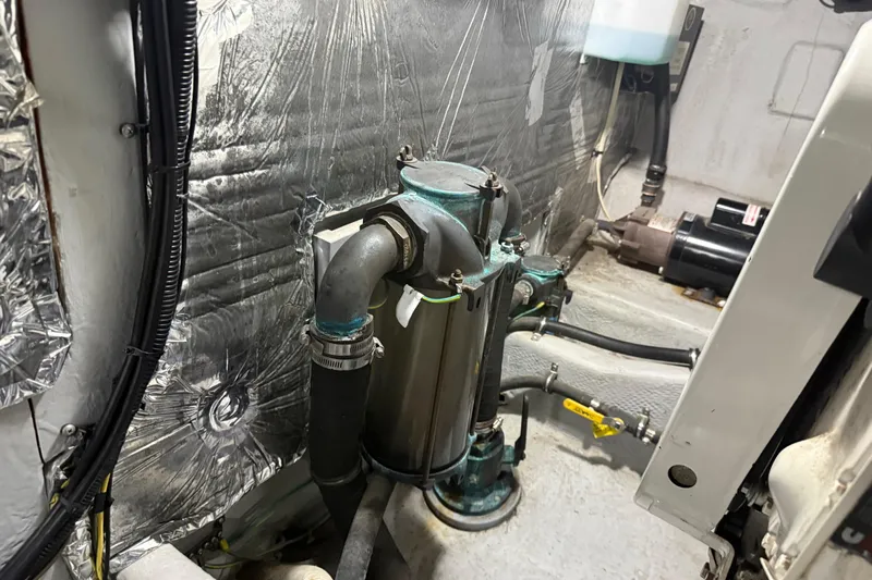  Yacht Photos Pics Engine room of 2004 Meridian 411 Sedan with visible piping and insulation.