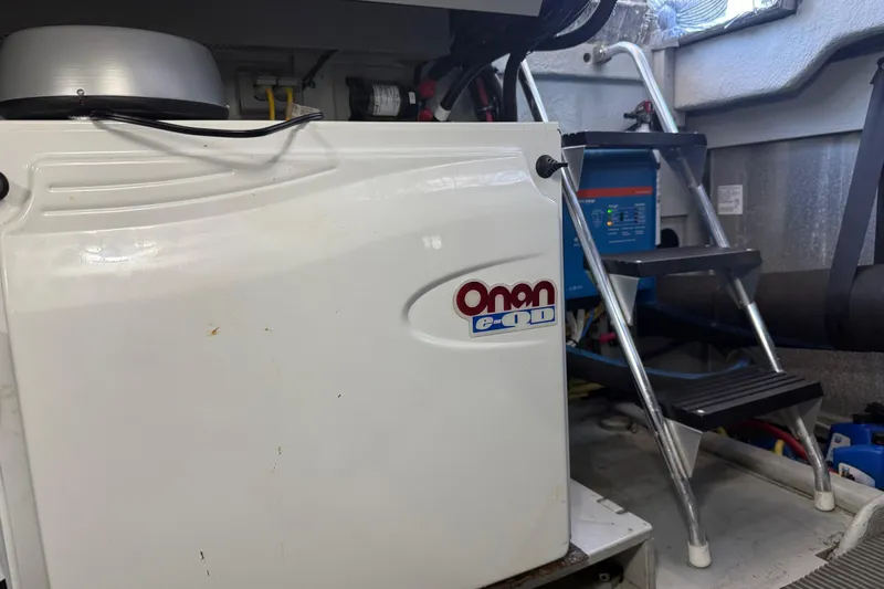  Yacht Photos Pics Engine room of 2004 Meridian 411 Sedan with Onan generator and ladder.