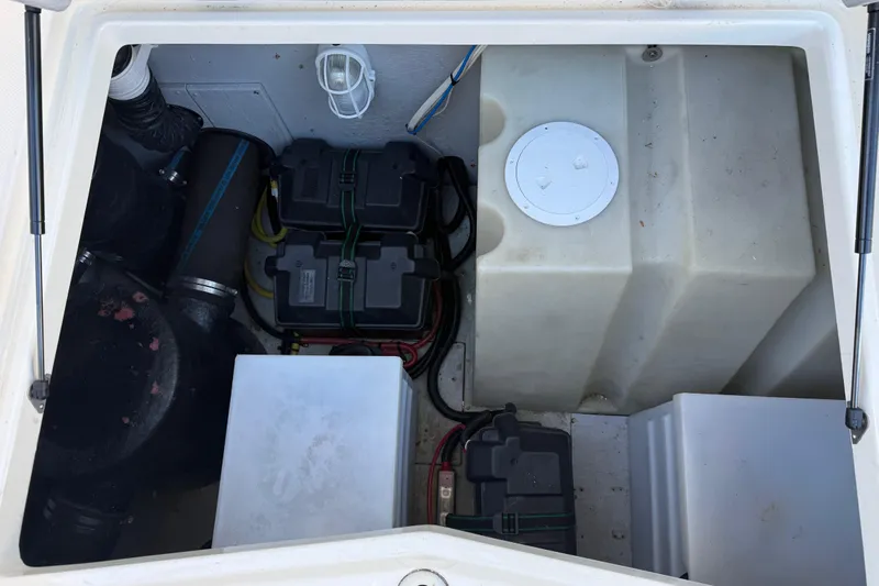 Yacht Photos Pics Engine compartment of a 2004 Meridian 411 Sedan, showing batteries and wiring.