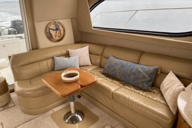  Yacht Photos Pics Luxurious interior of 2004 Meridian 411 Sedan yacht with leather seating and decorative pillows.