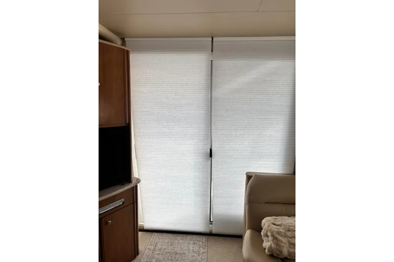  Yacht Photos Pics Interior of 2004 Meridian 411 Sedan with closed blinds and cozy seating area.