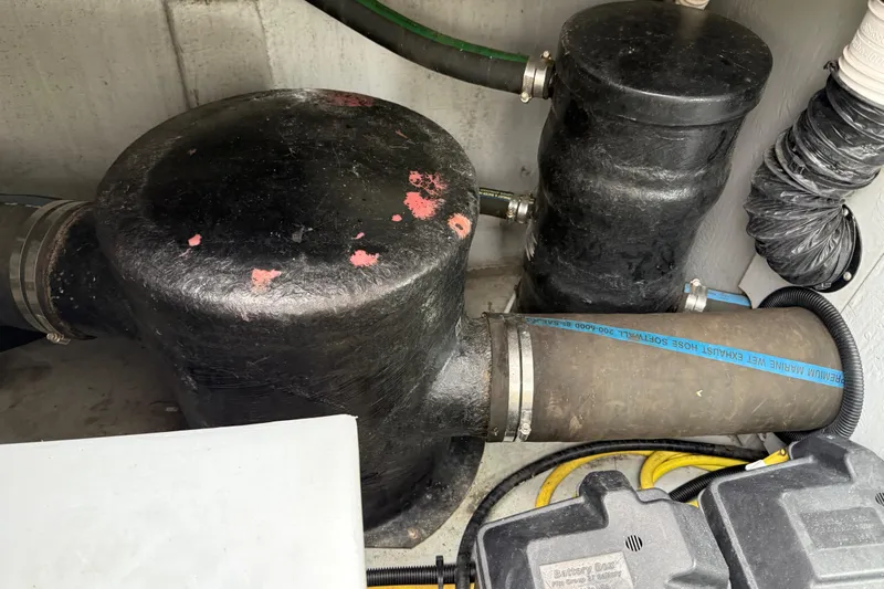  Yacht Photos Pics Engine compartment of 2004 Meridian 411 Sedan with exhaust components and hoses.