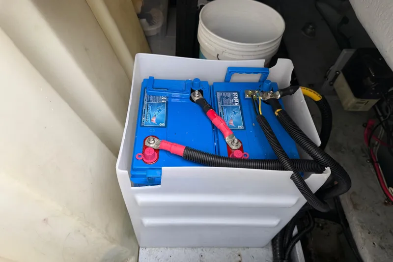  Yacht Photos Pics Battery compartment of a 2004 Meridian 411 Sedan with blue marine battery.