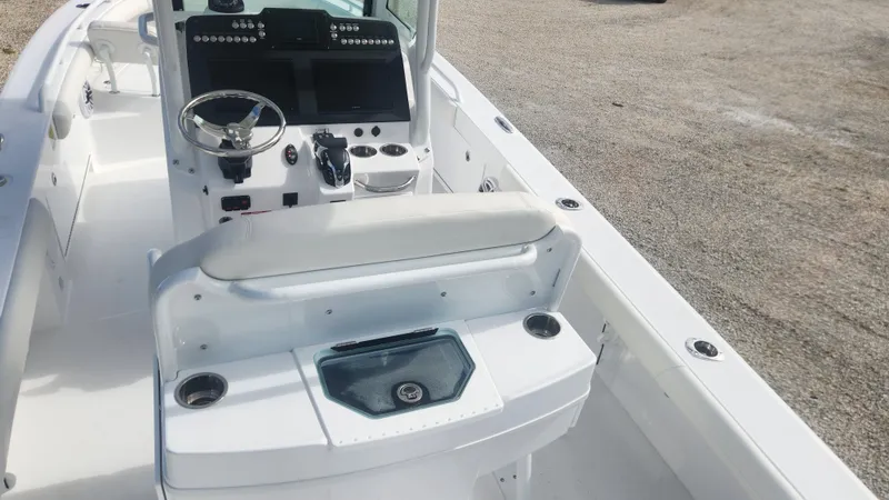  Yacht Photos Pics 2025 Everglades 253 Center Console boat interior with steering wheel and seating.