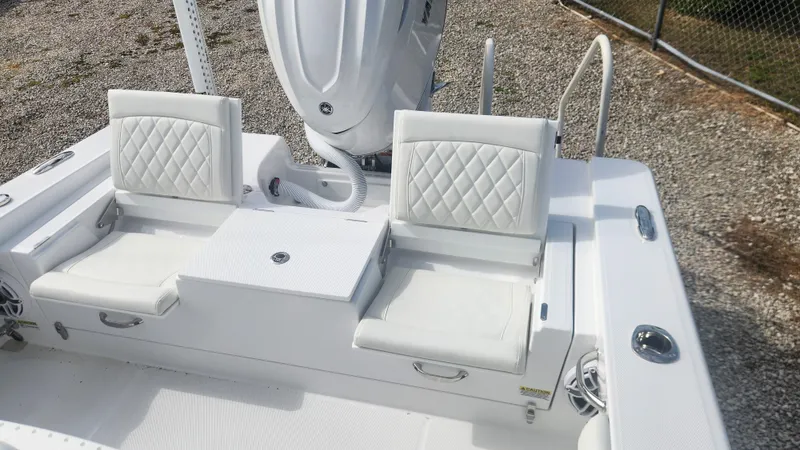  Yacht Photos Pics 2025 Everglades 253 Center Console boat with white cushioned seating and sleek design.