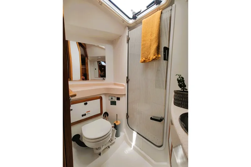 Alola Yacht Photos Pics Bathroom interior of 2003 Catalina 42 MkII yacht, featuring a compact design with a shower and toilet.
