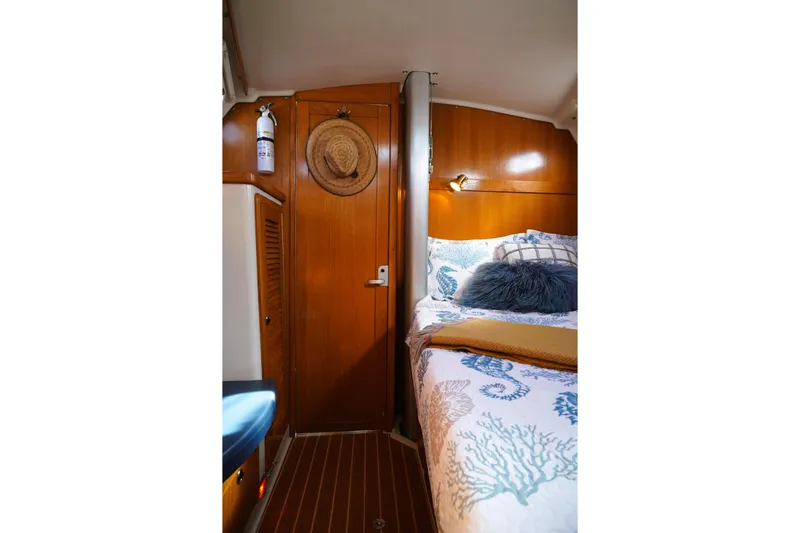 Alola Yacht Photos Pics Cozy cabin interior of 2003 Catalina 42 MkII sailboat with nautical decor.