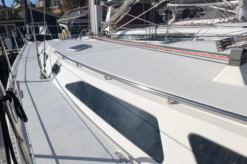 Alola Yacht Photos Pics 2003 Catalina 42 MkII sailboat deck with stainless steel railings and hatches.