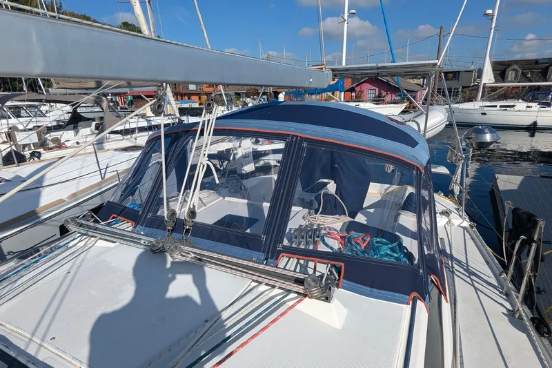 Alola Yacht Photos Pics 2003 Catalina 42 MkII sailboat docked at marina, featuring blue canvas cover and rigging.