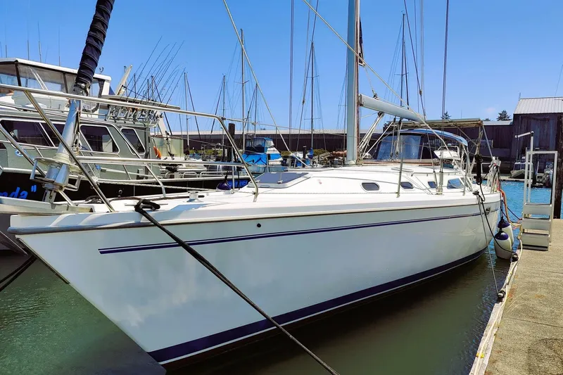 Alola Yacht Photos Pics 2003 Catalina 42 MkII sailboat docked at marina, clear blue sky.