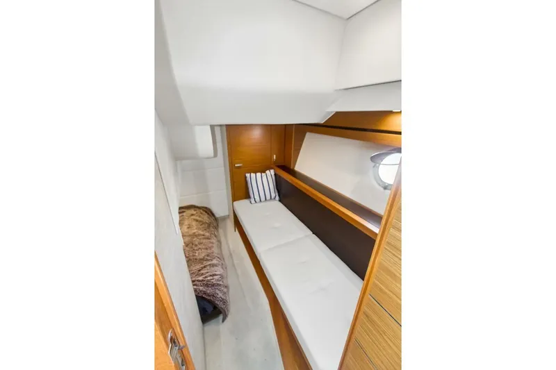 Pour It On Yacht Photos Pics 2017 Tiara Yachts C39 Coupe cabin interior with cozy bedding and modern design.
