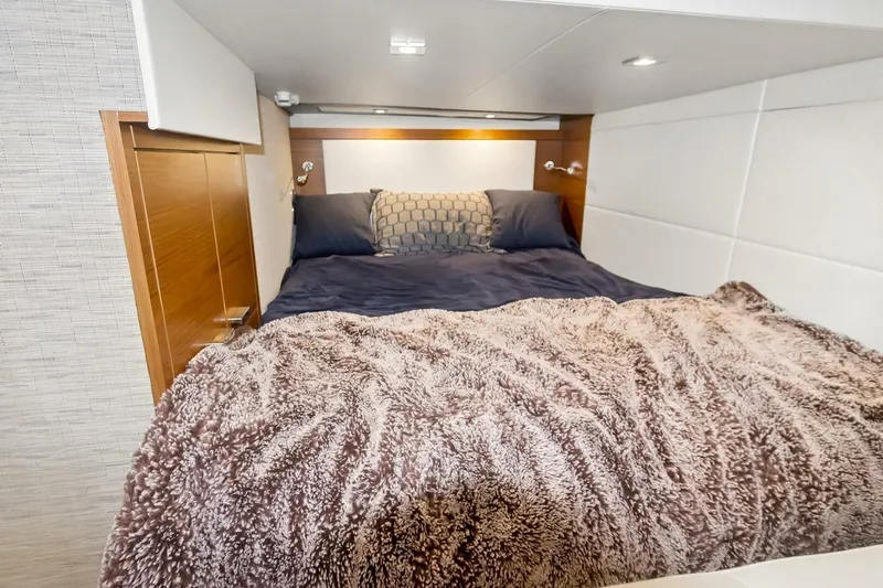Pour It On Yacht Photos Pics Cozy bedroom interior of 2017 Tiara Yachts C39 Coupe with plush bedding.