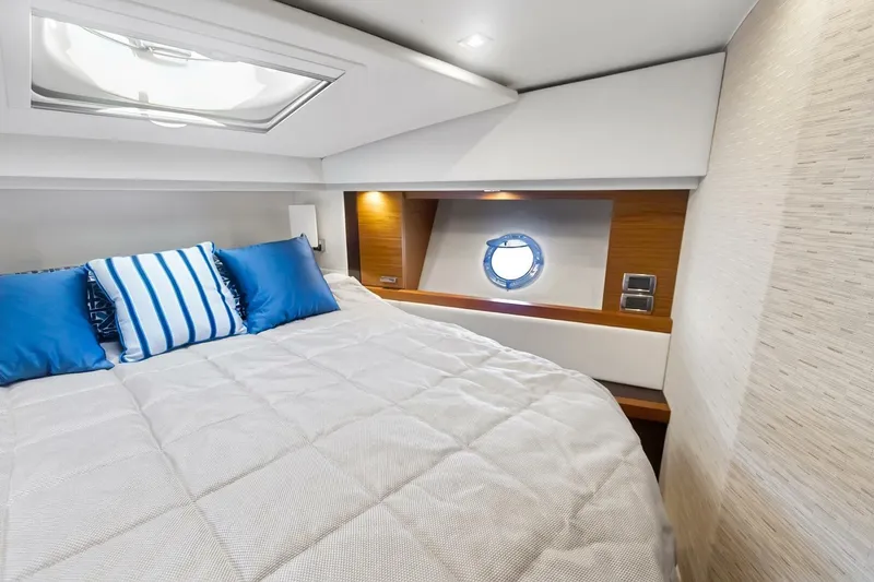 Pour It On Yacht Photos Pics Luxurious cabin interior of 2017 Tiara Yachts C39 Coupe with plush bedding.