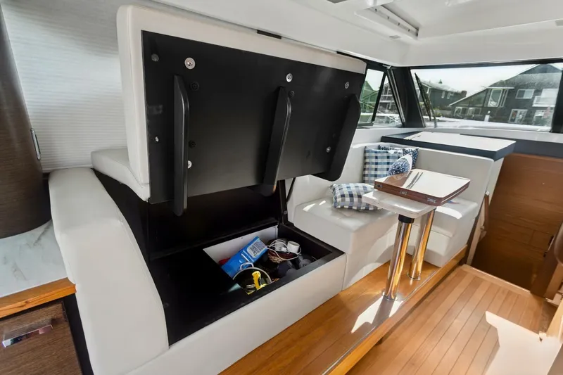 Pour It On Yacht Photos Pics Interior of 2017 Tiara Yachts C39 Coupe with storage and seating area.