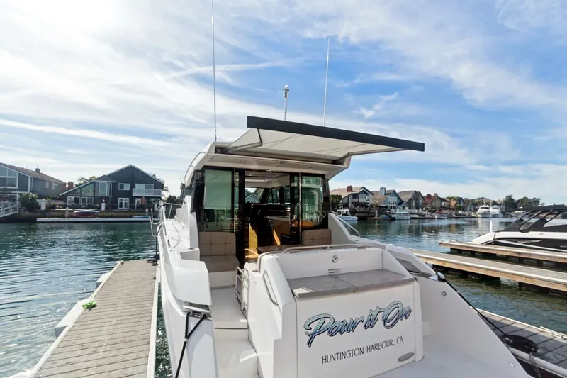 Pour It On Yacht Photos Pics 2017 Tiara Yachts C39 Coupe docked at Huntington Harbour, CA, under a clear sky.