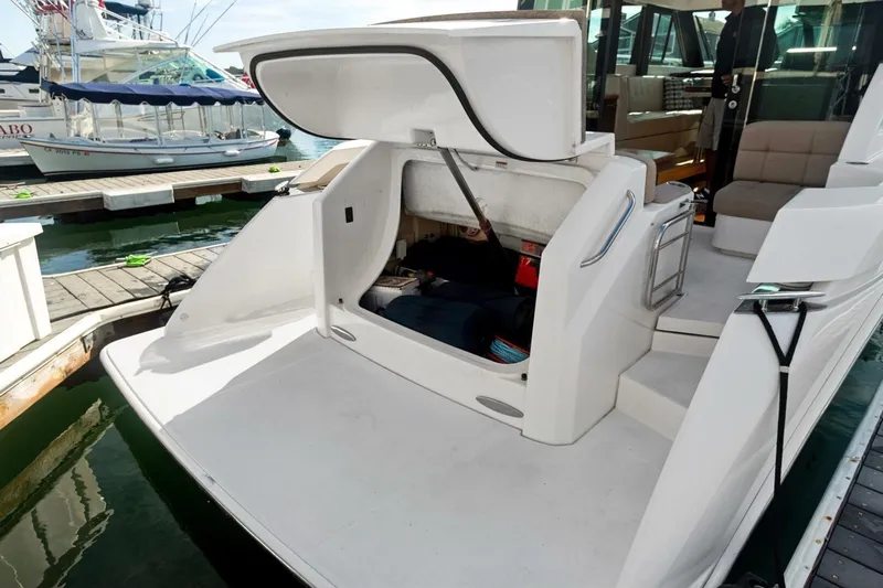 Pour It On Yacht Photos Pics 2017 Tiara Yachts C39 Coupe with open storage compartment at marina dock.
