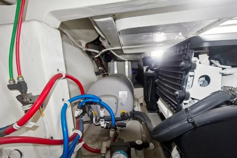 Pour It On Yacht Photos Pics Engine compartment of 2017 Tiara Yachts C39 Coupe with visible wiring and components.