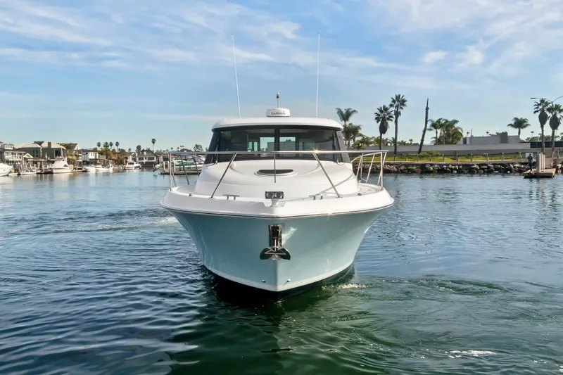 Pour It On Yacht Photos Pics 2017 Tiara Yachts C39 Coupe cruising in a scenic marina setting.