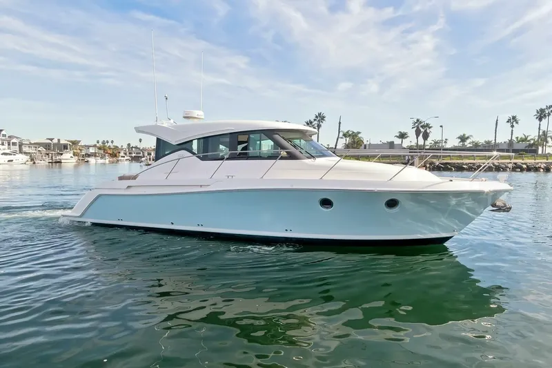 Pour It On Yacht Photos Pics 2017 Tiara Yachts C39 Coupe cruising on calm waters under a clear sky.