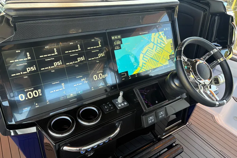  Yacht Photos Pics 2024 Nor-Tech 400 Supersport dashboard with dual screens and modern steering wheel.