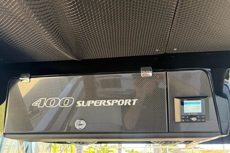  Yacht Photos Pics 2024 Nor-Tech 400 Supersport dashboard with carbon fiber finish and JL Audio system.