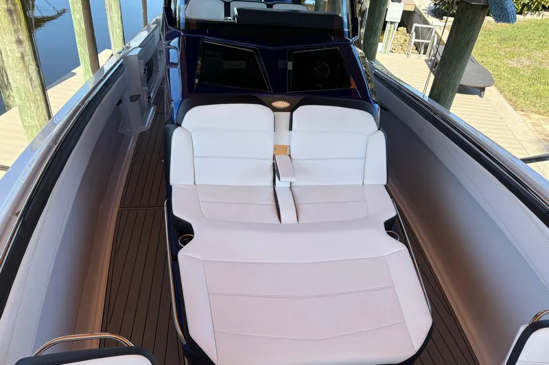  Yacht Photos Pics 2024 Nor-Tech 400 Supersport boat with luxurious white seating and sleek design.