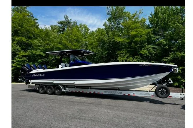  Yacht Photos Pics 2024 Nor-Tech 400 Supersport boat on trailer outdoors.