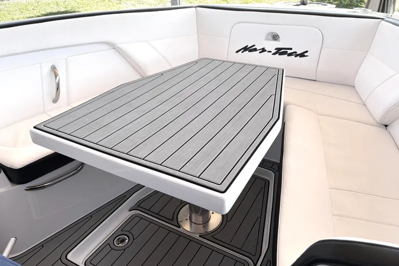  Yacht Photos Pics 2024 Nor-Tech 400 Supersport interior with sleek seating and stylish table design.