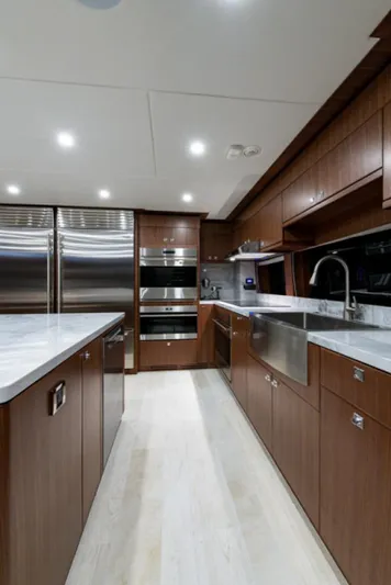 Congvoyage Yacht Photos Pics Modern kitchen in 2020 Hargrave G120 yacht with stainless steel appliances and wooden cabinetry.