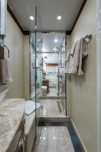 Congvoyage Yacht Photos Pics Luxurious bathroom in a 2020 Hargrave G120 yacht with glass shower and marble finishes.