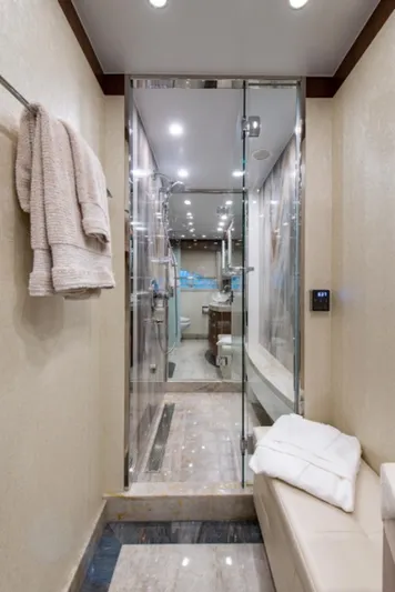 Congvoyage Yacht Photos Pics Luxurious bathroom in a 2020 Hargrave G120 yacht with glass shower and modern fixtures.