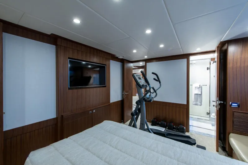Congvoyage Yacht Photos Pics Luxury bedroom with exercise equipment on 2020 Hargrave G120 yacht.