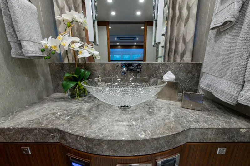 Congvoyage Yacht Photos Pics Luxurious bathroom vanity in 2020 Hargrave G120 yacht with glass sink and marble countertop.