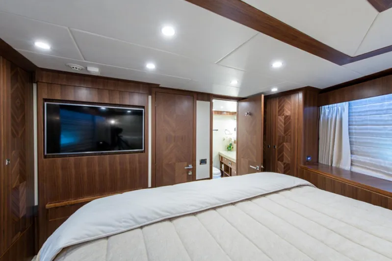 Congvoyage Yacht Photos Pics Luxurious bedroom interior of 2020 Hargrave G120 yacht with TV and ensuite bathroom.