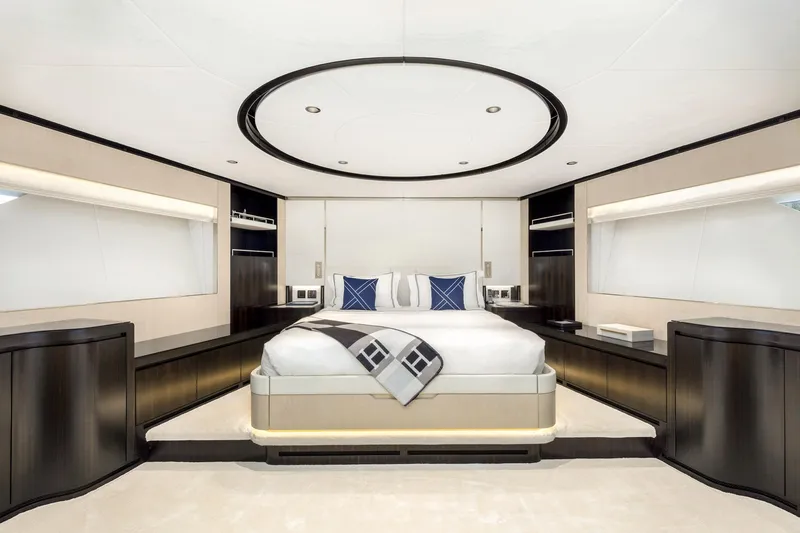 Rocket One Yacht Photos Pics Luxurious bedroom interior of 2022 Gulf Craft Majesty 120 yacht, featuring modern design and elegant furnishings.