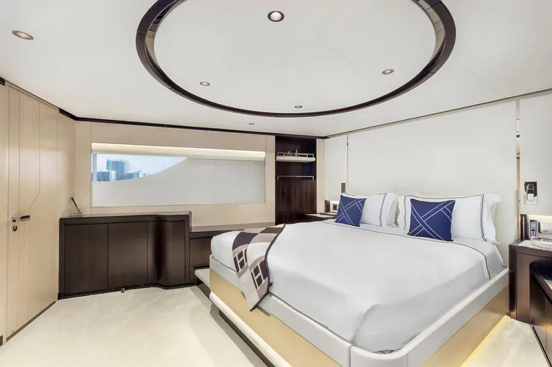 Rocket One Yacht Photos Pics Luxurious bedroom interior on 2022 Gulf Craft Majesty 120 yacht, featuring modern design and elegant furnishings.