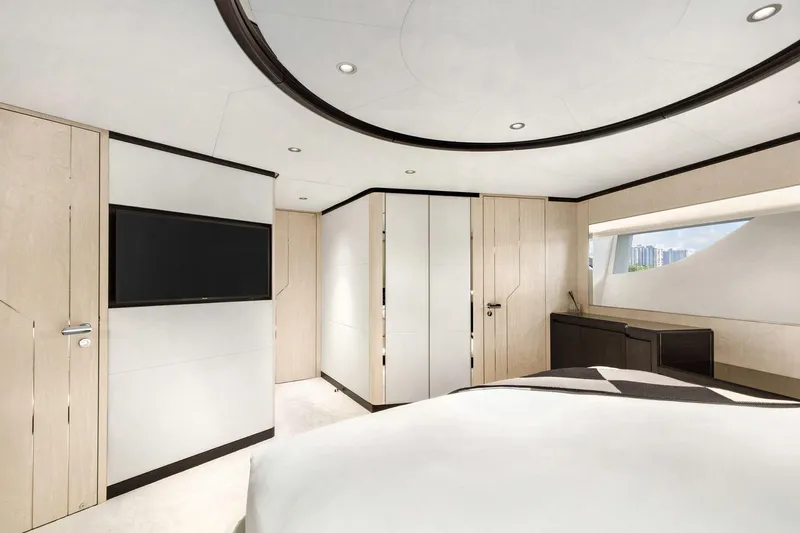 Rocket One Yacht Photos Pics Luxurious bedroom interior of 2022 Gulf Craft Majesty 120 yacht, featuring modern design and elegant furnishings.