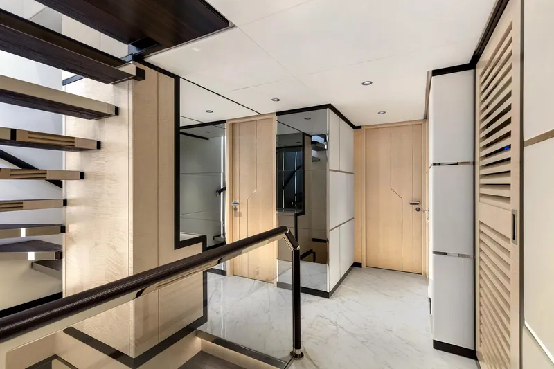 Rocket One Yacht Photos Pics Luxurious interior of 2022 Gulf Craft Majesty 120 yacht with modern staircase and elegant design.