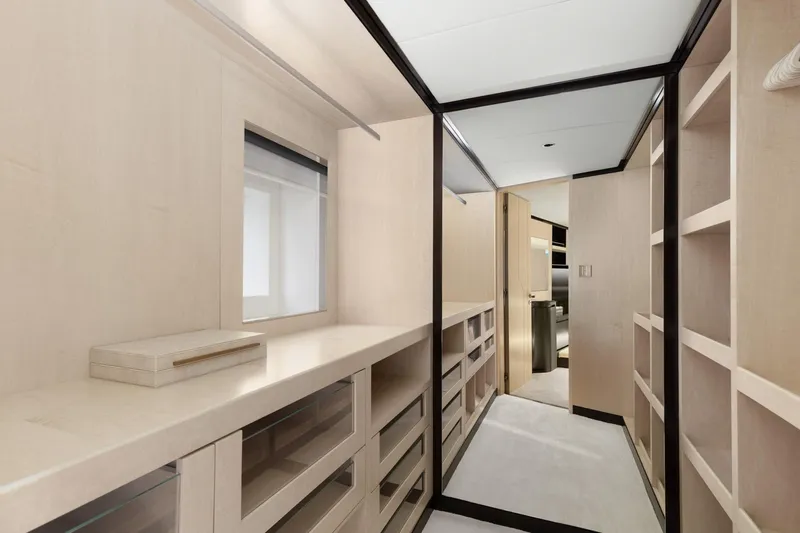 Rocket One Yacht Photos Pics Luxurious walk-in closet on 2022 Gulf Craft Majesty 120 yacht, featuring sleek cabinetry and modern design.