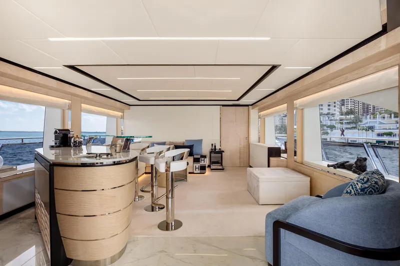 Rocket One Yacht Photos Pics Luxurious interior of 2022 Gulf Craft Majesty 120 yacht with modern furnishings and panoramic windows.