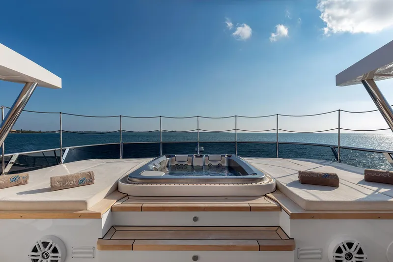 Rocket One Yacht Photos Pics Luxurious 2022 Gulf Craft Majesty 120 yacht deck with jacuzzi and ocean view.